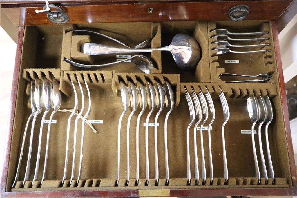 A Mappin & Webb part service of plated flatware in mahogany table canteen